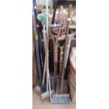 A collection of garden implements, brushes etc