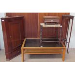 A 20th century mahogany hanging corner cupboard together with a teak coffee table with a smoked