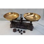 A pair of French brass and cast iron scales, with dished pans, the shaped base cast ''F10K''