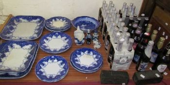 A blue and white part dinner set together with Delft pottery and Ind Coope Strong Lager brewed in