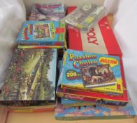 A collection of Jigsaw puzzles, together with board games and Railway magazines