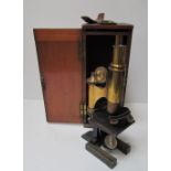 A Ross of London lacquered brass monocular microscope, cased