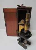 A Ross of London lacquered brass monocular microscope, cased