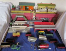 A Hornby Series tin plate locomotive and tender together with assorted carriages, railway stations