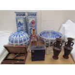 Glass oil lamps together with coloured glass decanters, blue and white vases and bowls, magnifying