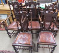 A set of five oak dining chairs with barley twist supports and a bergere back with drop in seats