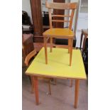 A mid 20th century melamine topped kitchen table together with a set of three chairs