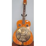 A Hudson Resonator acoustic guitar, cased, together with a Marshall amp, a guitar stand and a