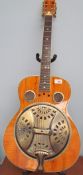 A Hudson Resonator acoustic guitar, cased, together with a Marshall amp, a guitar stand and a