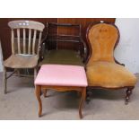 A Victorian mahogany framed nursing chair, with button back upholstery together with a Regency style