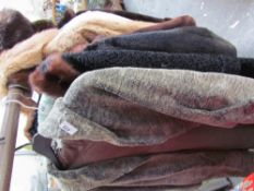 A collection of fur and simulated fur coats, hats, stoles etc