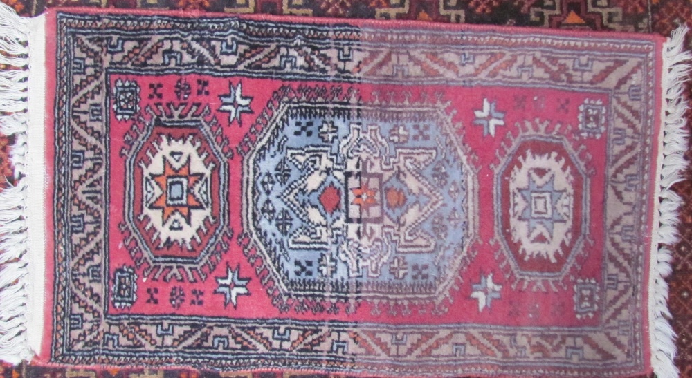 A small orange ground rug decorated with geometric panels and border together with a small pink - Image 2 of 2