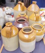 A stoneware flask for E.H. James together with a collection of stoneware storage jars and jugs