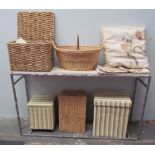 A collection of assorted baskets and boxes together with linens