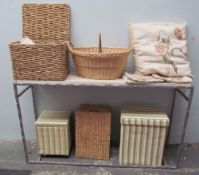 A collection of assorted baskets and boxes together with linens