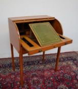 An Edwardian satinwood bureau with cylinder tambour and pull out writing surface fitted with drawers