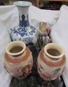 A pair of satsuma pottery vases, together with a Chinese vase and a pottery figure