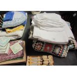 A collection of table linen, blankets, coasters, table mats etc