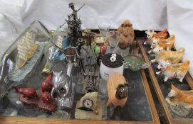 Two ships in bottles together with figures made from nuts and bolts, squirrel nutcracker, cow