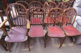 A set of four stick back dining chairs (includes a carver) together with a set of four wheel back