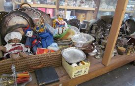 A large lot including electroplated wares, brass candlesticks, flatwares, dolls, assorted plates,