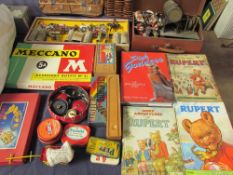 A Meccano set together with Meccano spares, Rupert books, lead figures, etc