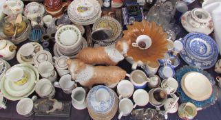 A large lot including a pair of Staffordshire type dogs together with blue and white tea cups,