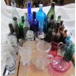 A Ross's Dumfries reliable Ginger Beer bottle together with other glass bottles, cranberry glass