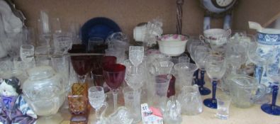 Assorted drinking glasses together with part tea sets, pottery clock, etc