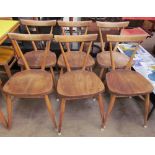 A set of six Ercol elm seated stacking dining chairs, Patent No. 845,582, Reg. Design No. 884892