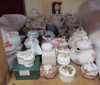A collection of porcelain boxes and covers together with miniature teapots etc