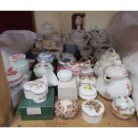 A collection of porcelain boxes and covers together with miniature teapots etc