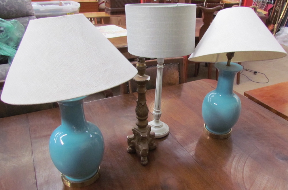 A pair of turquoise pottery baluster table lamps together with three other table lamps