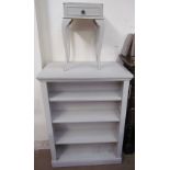 A pair of grey painted bookcases together with a similarly painted bedside table