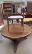A Victorian mahogany supper table with a circular top and octagonal column and trefoil base and