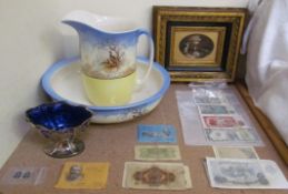 A pottery jug and basin, together with assorted bank notes, electroplated swing handled sugar basket