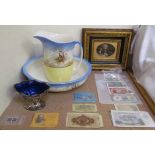 A pottery jug and basin, together with assorted bank notes, electroplated swing handled sugar basket