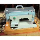 A Brother electric sewing machine, cased