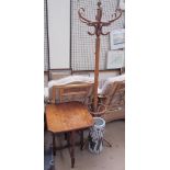 An Edwardian mahogany folding table together with a bentwood hat and coat stand and an umbrella