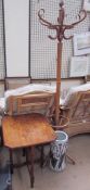 An Edwardian mahogany folding table together with a bentwood hat and coat stand and an umbrella