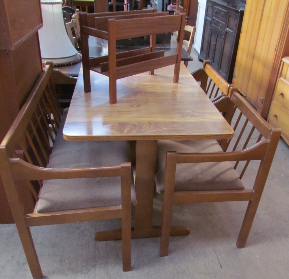 A 20th century modern kitchen dining table, bench and two chairs together with a teak magazine rack