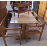 A 20th century modern kitchen dining table, bench and two chairs together with a teak magazine rack
