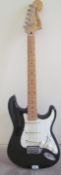 A Squier stratocaster six string guitar, by Fender No. IC040967340