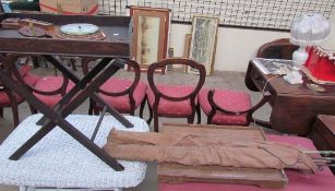 An oak barometer together with fishing rods and reel, bottles, a tray on stand, and a table