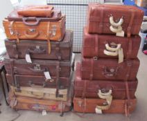 A collection of leather suitcases of varying designs and sizes