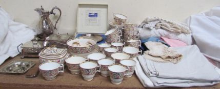 A 19th century porcelain part tea and coffee set painted with roses and gilt panels, together with