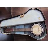 An eight string banjo / mandolin, with case
