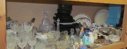 A large lot including assorted decorative plates together with drinking glasses, glass decanters,