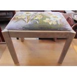 A dressing table stool, the pad seat embroidered with daffodils by Angela Dewar embroidery