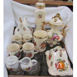 Kilncraft pottery mugs decorated with fruit together with other pottery items including a teapot,